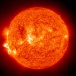 IN SPACE - NOVEMBER 18:  In this handout photo provided by NASA, a Solar and Heliospheric Observatory image shows Region 486 that unleashed a record flare last week (lower left) November 18, 2003 on the sun. The spot itself cannot yet be seen but large, hot, gas-filled loops above this region are visible. These post-flare loops are still active.  (Photo by NASA via Getty Images)
